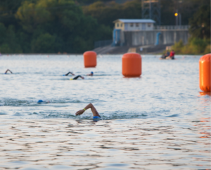 Participants swimming along the buoys in Nimitz Lake
