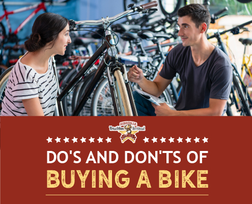 A female customer speaks with a bike shop sales representative in front of a row of bikes. Text on design reads Dos and Don'ts of Bike Buying. Learn more at https://kerrvilletri.com/2020/10/bike-buying/