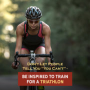 Cyclist rides her bike on a road through a forrest during a triathlon. Text on design reads Don't Let People Say You Can't - Be Inspired to Train for a Triathlon. Read more at http://kvy.b5e.myftpupload.com/2021/07/dont-let-others-say-you-cant-complete-a-triathlon